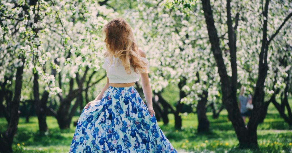 Woman wearing a Mini top with a loose comfy floral skirt